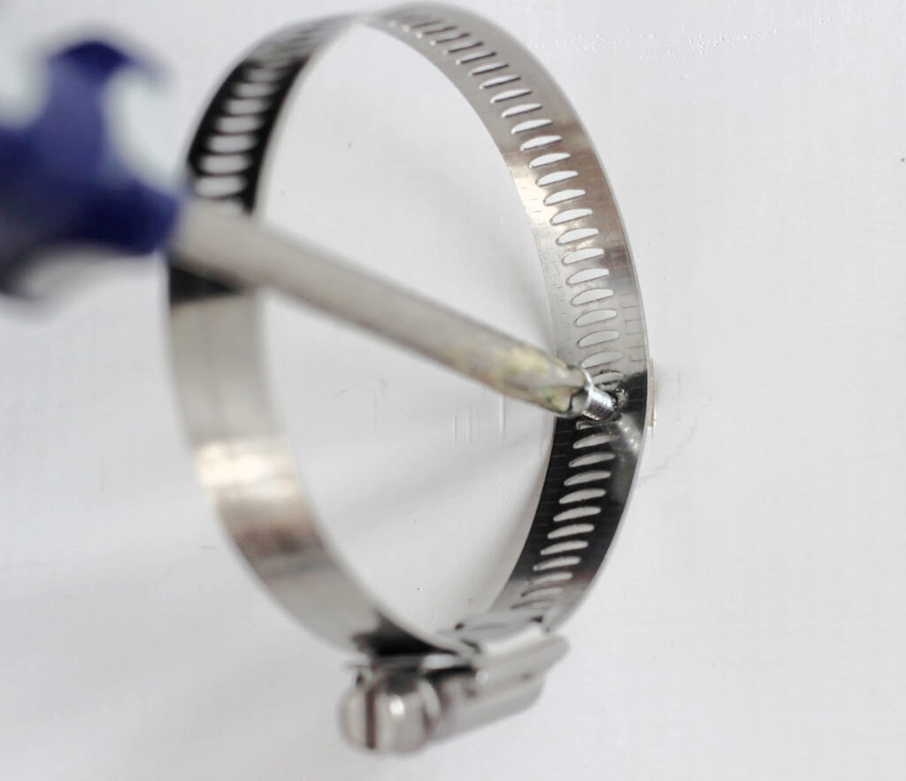 how to attach the clamp to the board with a screw.