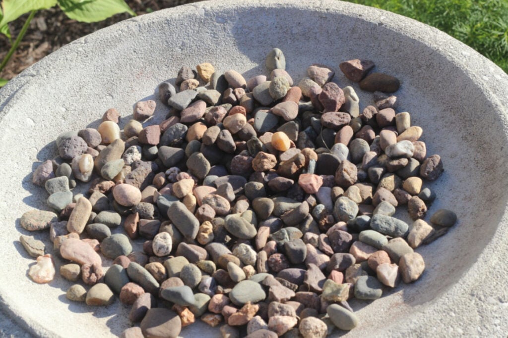 layer of stones in the birdbath to help with drainage
